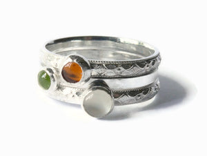 Sterling silver gemstone stacking rings with peridot, moonstone, and amber