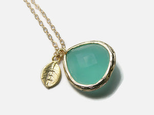 Gold necklace with aqua pendant and leaf initial pendant