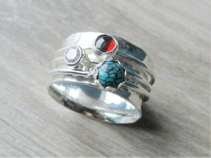Sterling silver spinning anxiety ring with garnet, turquoise and cubic zirconia gemstones