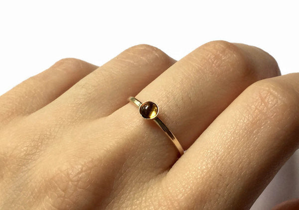 gold citrine ring modeled on hand