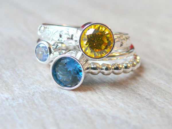 blue and yellow cubic zirconia rings