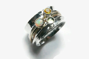silver spinning ring with opal