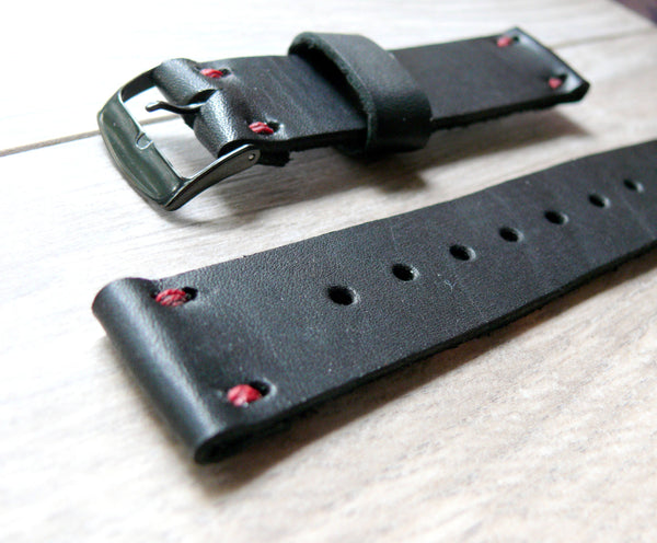 black leather watch band with red stitching