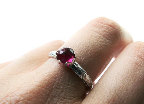 silver ruby ring on hand